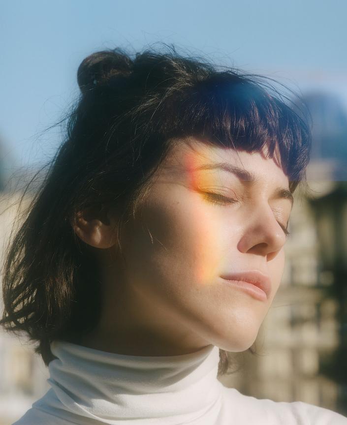 Portrait with a prism of light across the face